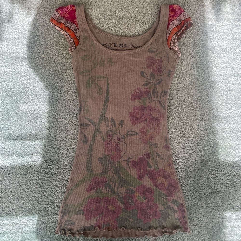 Adorable floral L.O.L. Vintage fitted tee with colorful details on the sleeves.